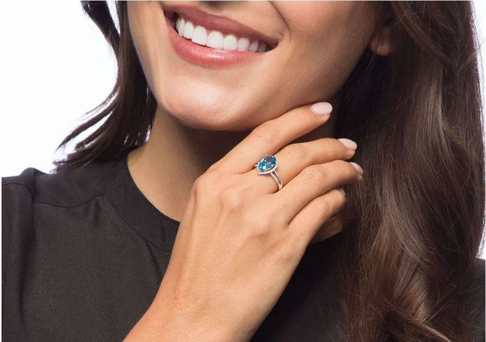 10k White Gold 3.10ct Pear-Shaped Blue Topaz and Halo Diamond Ring (1/4 cttw)