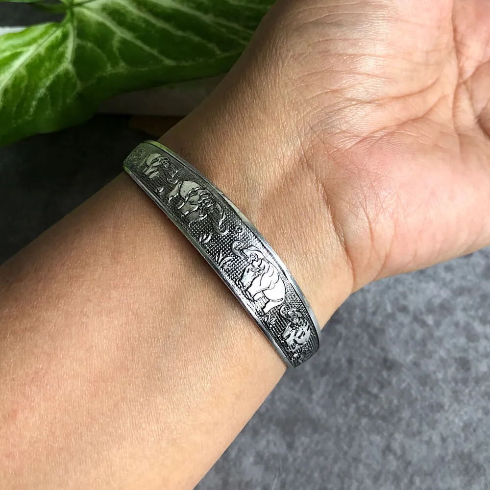 Ele Embossed Wrist Cuff