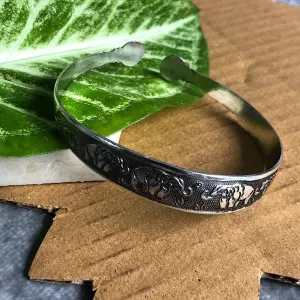 Ele Embossed Wrist Cuff