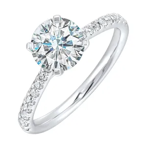 Petite set diamonds adds excitement to this classic solitaire ring perfectly showcases timeless love for her.